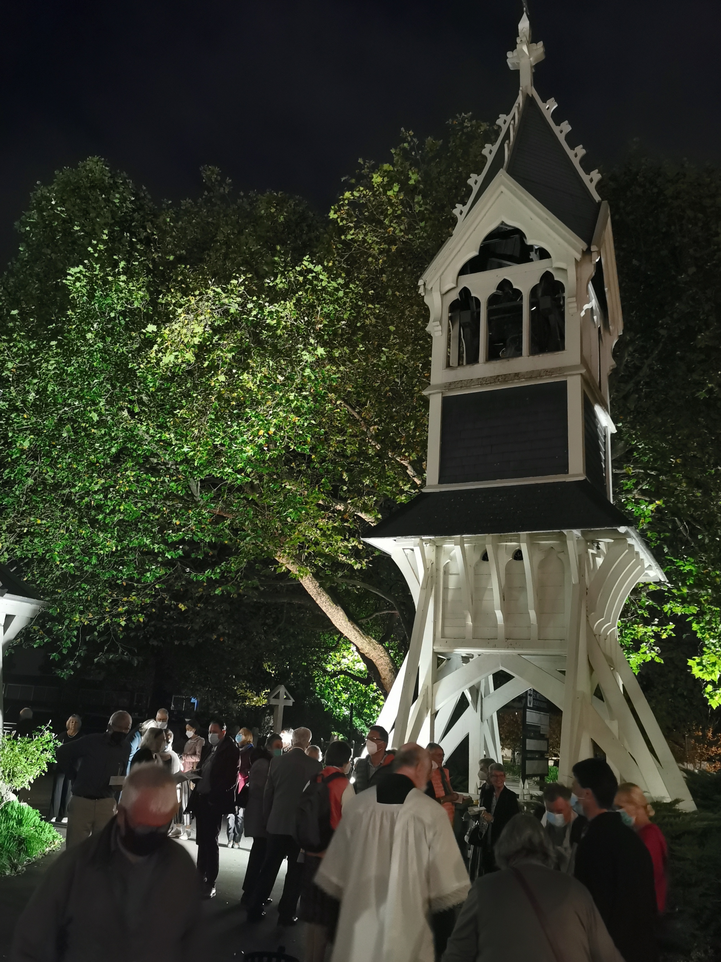 People gathering for the Easter Vigil by the bell tower.